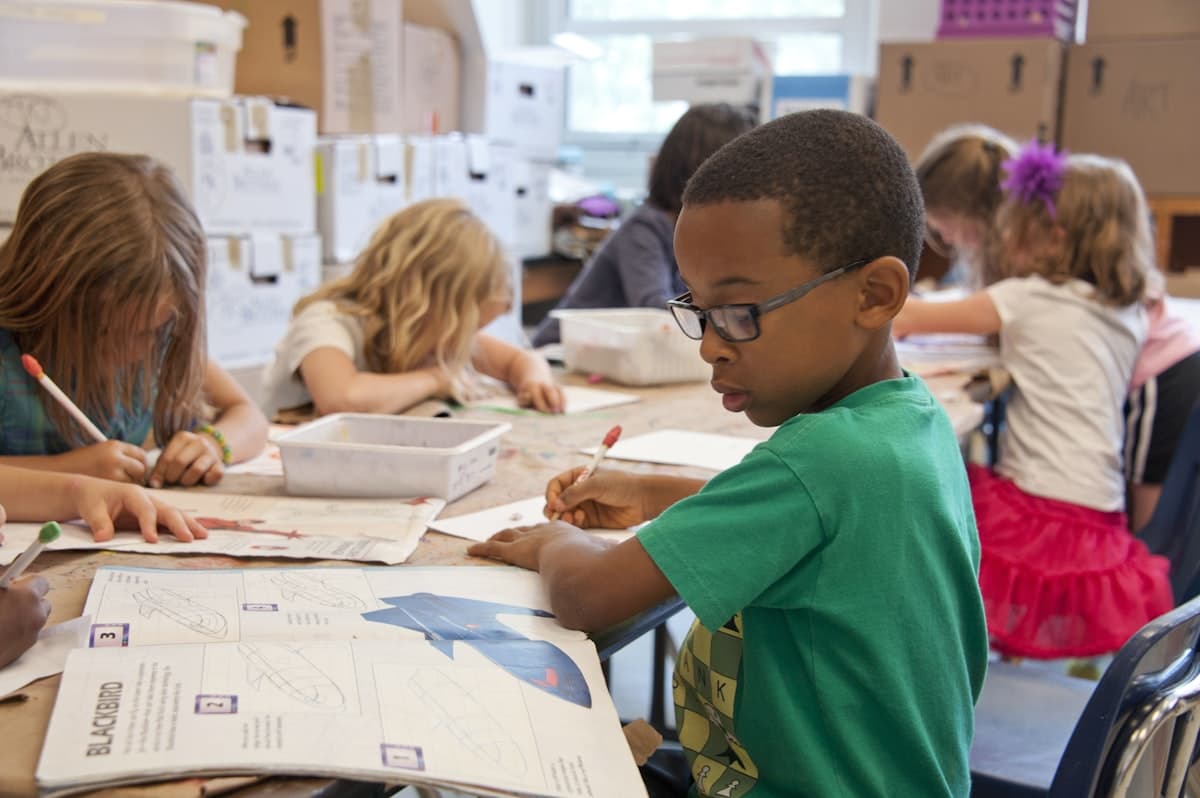 Children doing art projects in a classroom