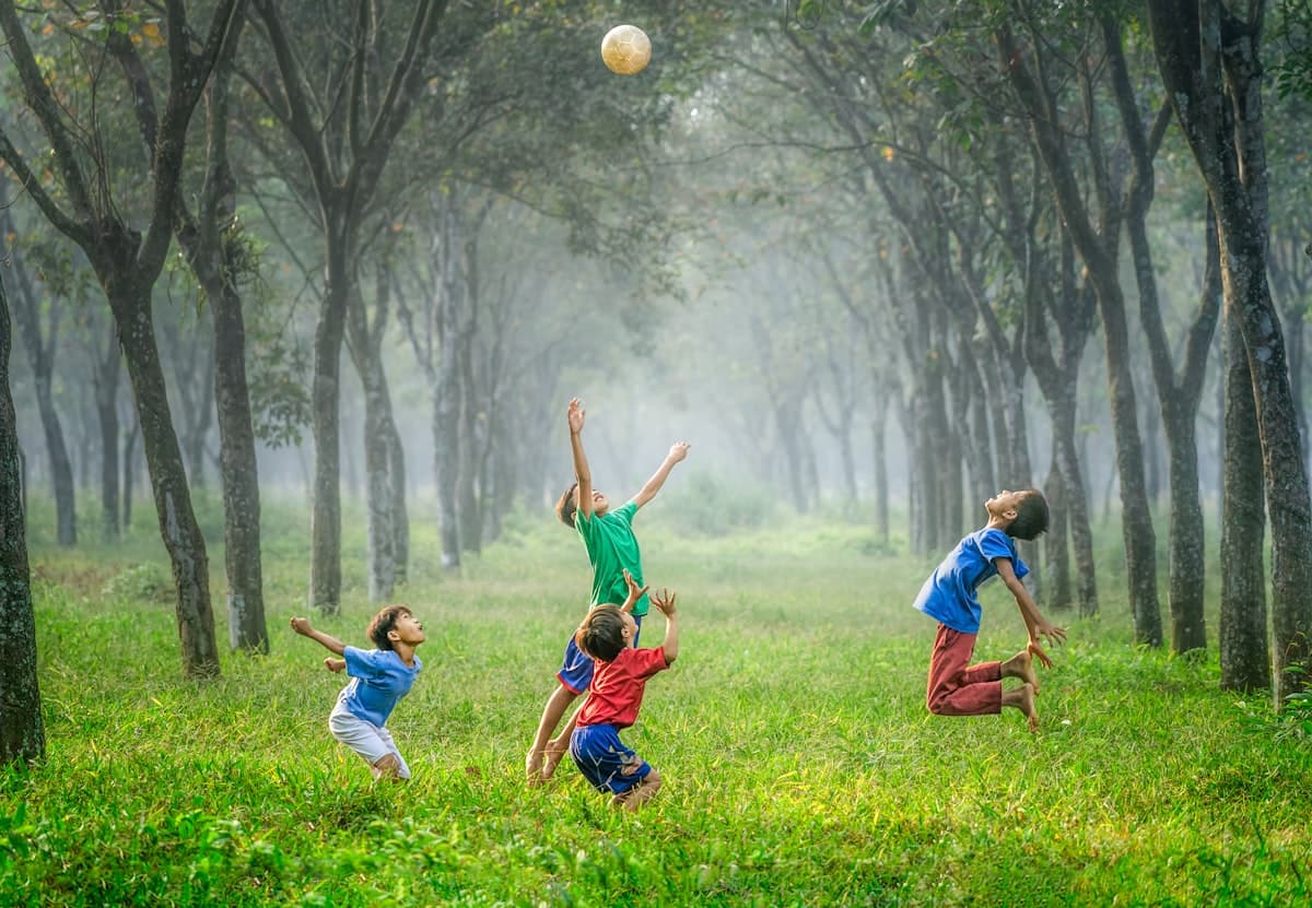Children playing with a ball outdoors